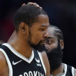 
              Brooklyn Nets guard James Harden pats the head of forward Kevin Durant in the second half of an NBA basketball game against the New Orleans Pelicans in New Orleans, Friday, Nov. 12, 2021. The Nets won 120-112. (AP Photo/Gerald Herbert)
            