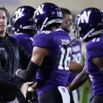 
              Northwestern head coach Pat Fitzgerald, left, cheers his team during the first half of an NCAA college football game against Iowa in Evanston, Ill., Saturday, Nov. 6, 2021. (AP Photo/Nam Y. Huh)
            