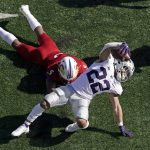 
              Kansas State running back Deuce Vaughn (22) is tackled by Kansas safety O.J. Burroughs (5) during the second half of an NCAA football game Saturday, Nov. 6, 2021, in Lawrence, Kan. (AP Photo/Charlie Riedel)
            