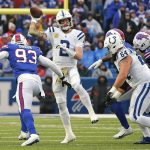 
              Indianapolis Colts quarterback Carson Wentz (2) gets off a pass under pressure by Buffalo Bills defensive end Efe Obada (93) during the second half of an NFL football game in Orchard Park, N.Y., Sunday, Nov. 21, 2021. The Colts won 41-15. (AP Photo/Jeffrey T. Barnes)
            