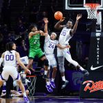 
              North Dakota guard Ethan Igbanugo (21) throws a pass across the court while defended by Kansas State guard Nijel Pack (24) and forward Kaosi Ezeagu (20) during the second half of an NCAA college basketball game on Sunday, Nov. 28, 2021, in Manhattan, Kan. Kansas State guard Mike McGuirl, left, looks on. (AP Photo/Nick Krug)
            