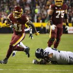 
              Washington Football Team running back J.D. McKissic (41) break away from Seattle Seahawks defensive tackle Bryan Mone (90) to score a touchdown during the first half of an NFL football game, Monday, Nov. 29, 2021, in Landover, Md. (AP Photo/Nick Wass)
            