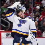 
              St. Louis Blues goaltender Jordan Binnington puts his helmet on during the first period of an NHL hockey game against the Chicago Blackhawks in Chicago, Friday, Nov. 26, 2021. (AP Photo/Nam Y. Huh)
            