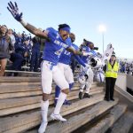 
              From left, Air Force defensive back James Jones IV joins cornerback Zion Kelly and fullback Emmanuel Michel in a victory dance after an NCAA college football game against UNLV Friday, Nov. 26, 2021, at Air Force Academy, Colo. Air Force won 48-14. (AP Photo/David Zalubowski)
            