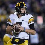 
              Iowa quarterback Spencer Petras looks to a pass against Northwestern during the first half of an NCAA college football game in Evanston, Ill., Saturday, Nov. 6, 2021. (AP Photo/Nam Y. Huh)
            