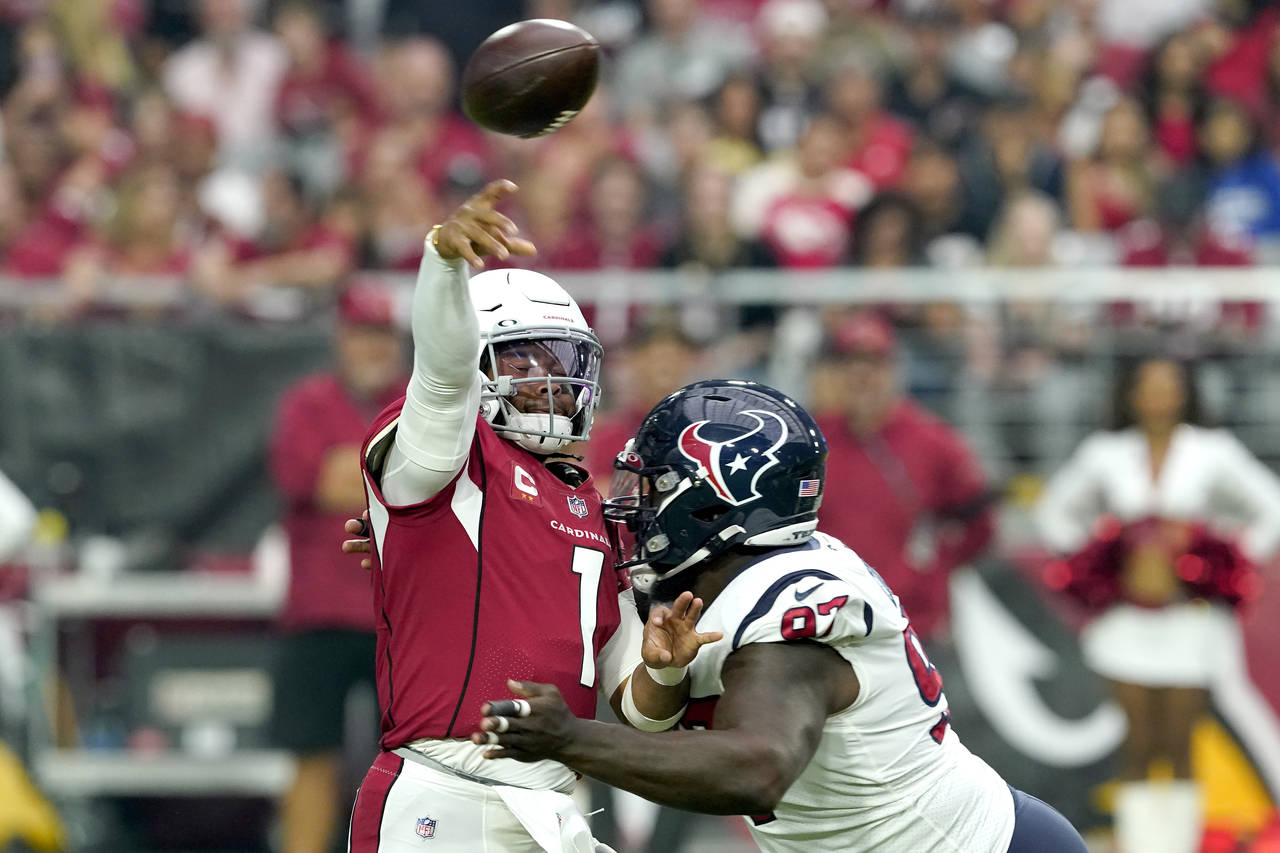 Arizona Cardinals quarterback Kyler Murray (1) throws under pressure from Houston Texans defensive ...