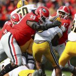 
              Georgia defensive lineman Jordan Davis levels Missouri running back Tyler Badie behind the line of scrimmage for a loss during the second half of an NCAA college football game in Athens, Ga., Saturday, Nov. 6, 2021. (Curtis Compton/Atlanta Journal-Constitution via AP)
            
