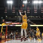 
              Minnesota Gophers guard E.J. Stephens (20) attempts a 3-pointer as Jacksonville guard Gyasi Powell (10) defends during the second half of an NCAA college basketball game Wednesday, Nov. 24, 2021, in Minneapolis. (Aaron Lavinsky/Star Tribune via AP)
            
