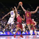 
              LSU forward Tari Eason (13) and Louisiana-Monroe guards Elijah Gonzales (3) and  Reginald Gee (5) go airborne for a rebound during an NCAA college basketball game Tuesday, Nov. 9, 2021, at the LSU PMAC in Baton Rouge, La. (Hilary Scheinuk/The Advocate via AP)
            