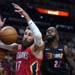 
              New Orleans Pelicans center Jonas Valanciunas (17) and Miami Heat center Dewayne Dedmon (21) go for a rebound during the first half of an NBA basketball game Wednesday, Nov. 17, 2021, in Miami. (AP Photo/Wilfredo Lee)
            