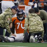 
              Denver Broncos offensive tackle Bobby Massie (70) receives attention from team staff after suffering an unknown injury in the first half of an NFL football game against the Dallas Cowboys in Arlington, Texas, Sunday, Nov. 7, 2021. (AP Photo/Ron Jenkins)
            