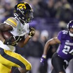 
              Iowa running back Tyler Goodson runs for a touchdown during the first half of an NCAA college football game against Northwestern in Evanston, Ill., Saturday, Nov. 6, 2021. (AP Photo/Nam Y. Huh)
            
