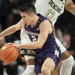 
              Northwestern guard Ryan Greer (2) dribbles around the defense of Wake Forest forward Dallas Walton (13) in the first half of an NCAA college basketball game on Tuesday, Nov. 30, 2021, at the Joel Coliseum in Winston-Salem, N.C. (Allison Lee Isley/The Winston-Salem Journal via AP)
            