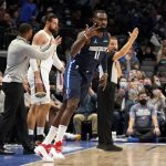 
              Dallas Mavericks forward Tim Hardaway Jr. (11) celebrates sinking a 3-point basket in the first half of an NBA basketball game against the New Orleans Pelicans in Dallas, Monday, Nov. 8, 2021. (AP Photo/Tony Gutierrez)
            