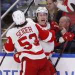 
              Detroit Red Wings left wing Tyler Bertuzzi (59) celebrates his goal with defenseman Moritz Seider (53) during the third period of an NHL hockey game against the Buffalo Sabres, Saturday, Nov. 6, 2021, in Buffalo, N.Y. (AP Photo/Jeffrey T. Barnes)
            
