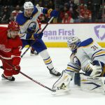 
              Buffalo Sabres goaltender Dustin Tokarski (31) deflects a shot by Detroit Red Wings center Pius Suter (24) with Sabres defenseman Colin Miller (33) helping defend the goal during the first period of an NHL hockey game Saturday, Nov. 27, 2021, in Detroit. (AP Photo/Duane Burleson)
            