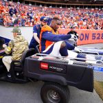 
              Denver Broncos offensive tackle Calvin Anderson (76) is carted off the field after an injury against the Los Angeles Chargers during the first half of an NFL football game, Sunday, Nov. 28, 2021, in Denver. (AP Photo/Jack Dempsey)
            