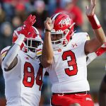 
              Maryland tight end Corey Dyches (84) and quarterback Taulia Tagovailoa (3) celebrate after a touchdown against Rutgers during the second half of an NCAA football game, Saturday, Nov. 27, 2021, in Piscataway, N.J. Maryland won 40-16. (AP Photo/Noah K. Murray)
            