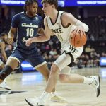 
              Wake Forest's Jake LaRavia drives to the basket under pressure from Charleston Southern's Jamir Moore during the first half of an NCAA college basketball game Wednesday, Nov. 17, 2021, in Winston-Salem, N.C. (Walt Unks/The Winston-Salem Journal via AP)
            