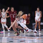 
              In this photo provided by Bahamas Visual Services, South Carolina forward Victaria Saxton (5) defends against UConn guard Paige Bueckers (5) during an NCAA college basketball game at Paradise Island, Bahamas, Monday, Nov. 22, 2021. (Tim Aylen/Bahamas Visual Services via AP)
            