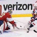 
              Washington Capitals center Evgeny Kuznetsov (92) attempts to shoot against Florida Panthers goaltender Spencer Knight during the second period of an NHL hockey game, Thursday, Nov. 4, 2021, in Sunrise, Fla. (AP Photo/Wilfredo Lee)
            