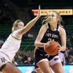 
              Baylor forward Caitlin Bickel (51) defends as West Texas A&M forward Alivia Lewis (21) positions for a shot in the first half of an exhibition NCAA college basketball game in Waco, Texas, Wednesday, Nov. 3, 2021. (AP Photo/Tony Gutierrez)
            