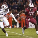 
              South Carolina running back ZaQuandre White (11) runs with the ball against Auburn cornerback Ro Torrence (14) during the second half of an NCAA college football game Saturday, Nov. 20, 2021, in Columbia, S.C. (AP Photo/Sean Rayford)
            