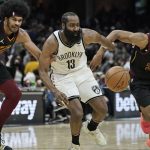 
              Cleveland Cavaliers' Jarrett Allen, left, Brooklyn Nets' James Harden and Cavaliers' Isaac Okoro battle vie a loose ball in the second half of an NBA basketball game Monday, Nov. 22, 2021, in Cleveland. (AP Photo/Tony Dejak)
            