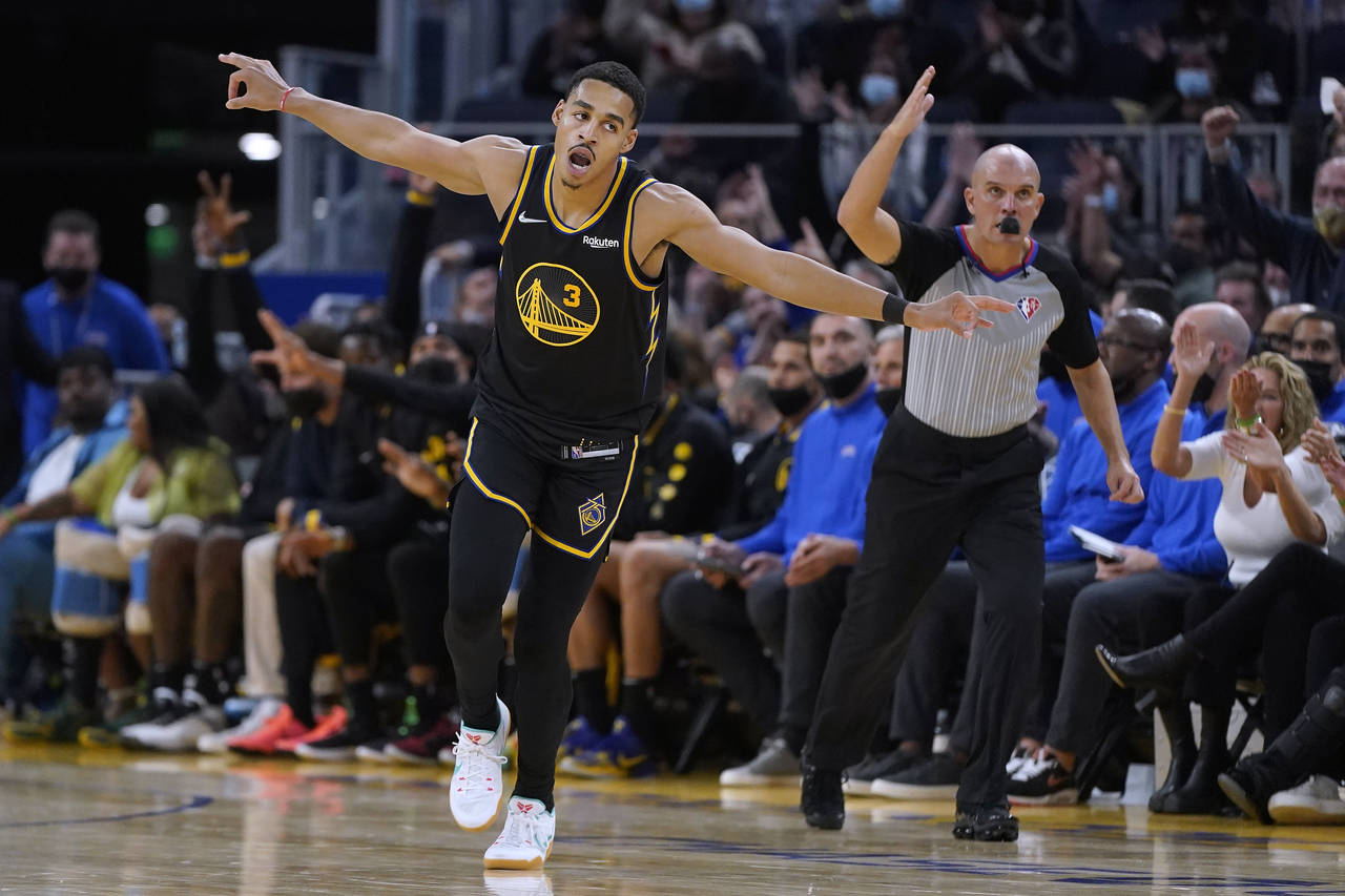 Golden State Warriors guard Jordan Poole (3) celebrates after making a 3-point basket against the N...