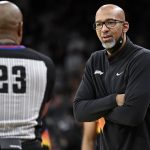 
              Phoenix Suns head coach Monte Williams, right, talks to referee Tre Maddox during the first half of an NBA basketball game against the San Antonio Spurs, Monday, Nov. 22, 2021, in San Antonio. (AP Photo/Darren Abate)
            