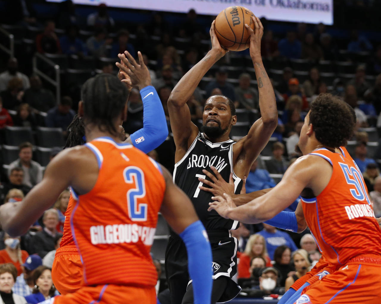 Brooklyn Nets forward Kevin Durant (7) goes against Oklahoma City Thunder guard Shai Gilgeous-Alexa...
