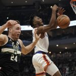 
              Milwaukee Bucks' Pat Connaughton knocks the ball from New York Knicks' Immanuel Quickley during the first half of an NBA basketball game Friday, Nov. 5, 2021, in Milwaukee. (AP Photo/Morry Gash)
            