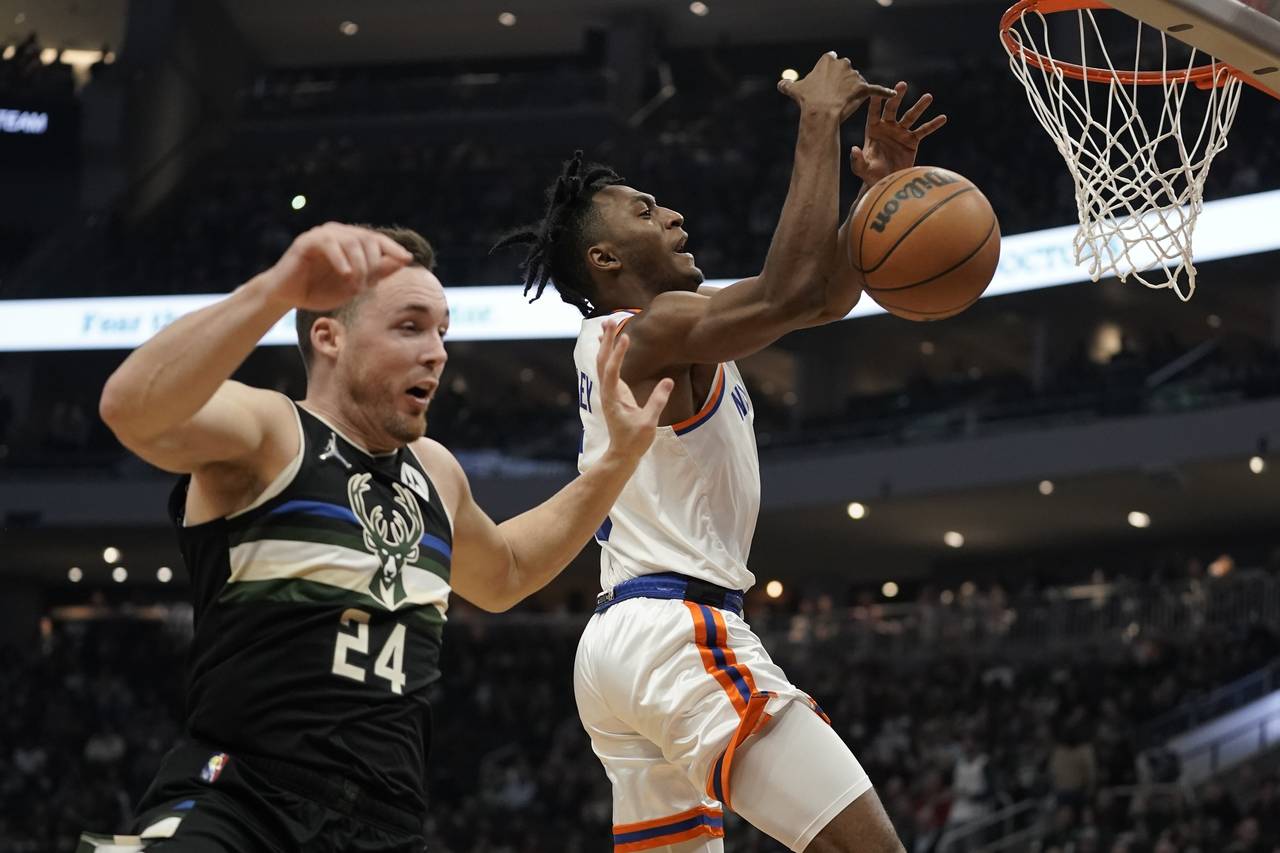Milwaukee Bucks' Pat Connaughton knocks the ball from New York Knicks' Immanuel Quickley during the...