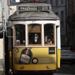 
              A tram conductor wearing a face mask drives along a street in Lisbon, Monday, Nov. 29, 2021. Portuguese health authorities on Monday identified 13 cases of omicron, the new coronavirus variant spreading fast globally, among members of the Lisbon-based Belenenses SAD soccer club, and were investigating possible local transmission of the virus outside of southern Africa. (AP Photo/Ana Brigida)
            