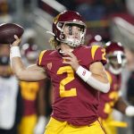 
              Southern California quarterback Jaxson Dart (2) throws a pass during the first half of an NCAA college football game against Brigham Young in Los Angeles, Saturday, Nov. 27, 2021. (AP Photo/Ashley Landis)
            