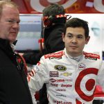 
              FILE - Car owner Chip Ganassi, left, and driver Kyle Larson talk in their garage during a practice session for a NASCAR Sprint Cup Series auto race at Daytona International Speedway in Daytona Beach, Fla., on Feb. 13, 2015. Chip Ganassi will close his 20-year run in NASCAR in Sunday’s, Nov. 7, 2021, season finale. Ganassi will attend his final race and watch Kyle Larson compete for the Cup title driving for Hendrick Motorsports. It was Ganassi who discovered Larson but he had to fire him last year when Larson used a racial slur. It was just one of the many bad breaks Ganassi suffered since entering NASCAR in 2001. (AP Photo/Terry Renna, File)
            
