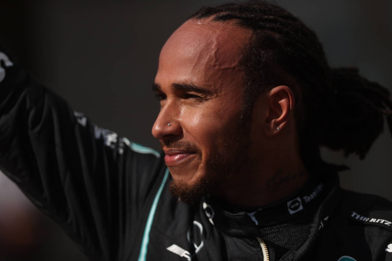 Mercedes driver Lewis Hamilton, of Britain, waves at the fans after coming in first in the Brazilia...