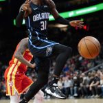 
              Orlando Magic guard Terrence Ross (31) loses control of the ball as he drives to the basket in the first half of an NBA basketball game against the Atlanta Hawks, Monday, Nov. 15, 2021, in Atlanta. (AP Photo/John Bazemore)
            