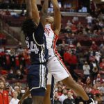 
              Ohio State's Zed Key, right, makes the game-winning basket over Akron's Ali Ali in the closing second of the second half of an NCAA college basketball game Tuesday, Nov. 9, 2021, in Columbus, Ohio. (AP Photo/Jay LaPrete)
            