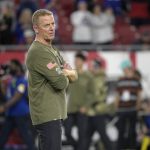 
              New York Giants offensive coordinator Jason Garrett watches players warm up before an NFL football game against the Tampa Bay Buccaneers, Monday, Nov. 22, 2021, in Tampa, Fla. The New York Giants have fired offensive coordinator Jason Garrett after a  dreadful performance in a nationally televised game against the Tampa Bay Buccaneers. The Giants (3-7) tweeted the decision Tuesday afternoon, saying the former Dallas Cowboys head coach had been relieved of his duties. (AP Photo/Phelan M. Ebenhack)
            