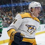 
              Nashville Predators left wing Tanner Jeannot celebrates scoring in the second period of an NHL hockey game against the Dallas Stars in Dallas, Wednesday, Nov. 10, 2021. (AP Photo/Tony Gutierrez)
            