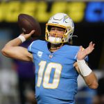 
              Los Angeles Chargers quarterback Justin Herbert (10) throws a pass during the first half of an NFL football game against the Minnesota Vikings, Sunday, Nov. 14, 2021, in Inglewood, Calif. (AP Photo/Gregory Bull)
            