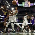 
              Los Angeles Lakers' Dwight Howard is fouled by Milwaukee Bucks' George Hill during the first half of an NBA basketball game Wednesday, Nov. 17, 2021, in Milwaukee. The Bucks won 109-102. (AP Photo/Morry Gash)
            
