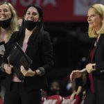 
              Maryland head coach Brenda Frese, right, smiles towards her team in the second half of an NCAA college basketball game against Villanova on Friday, Nov. 12, 2021, in College Park, Md. (AP Photo/Gail Burton)
            