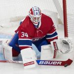 
              Montreal Canadiens goaltender Jake Allen makes a stick save against the Detroit Red Wings during the third period of an NHL hockey game Tuesday, Nov. 2, 2021, in Montreal. (Ryan Remiorz/The Canadian Press via AP)
            