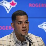 
              Jose Berrios speaks during a baseball press conference announcing his seven-year extension with the Toronto Blue Jays at Rogers Centre in Toronto on Thursday, Nov. 18, 2021. (Tijana Martin/The Canadian Press via AP)
            