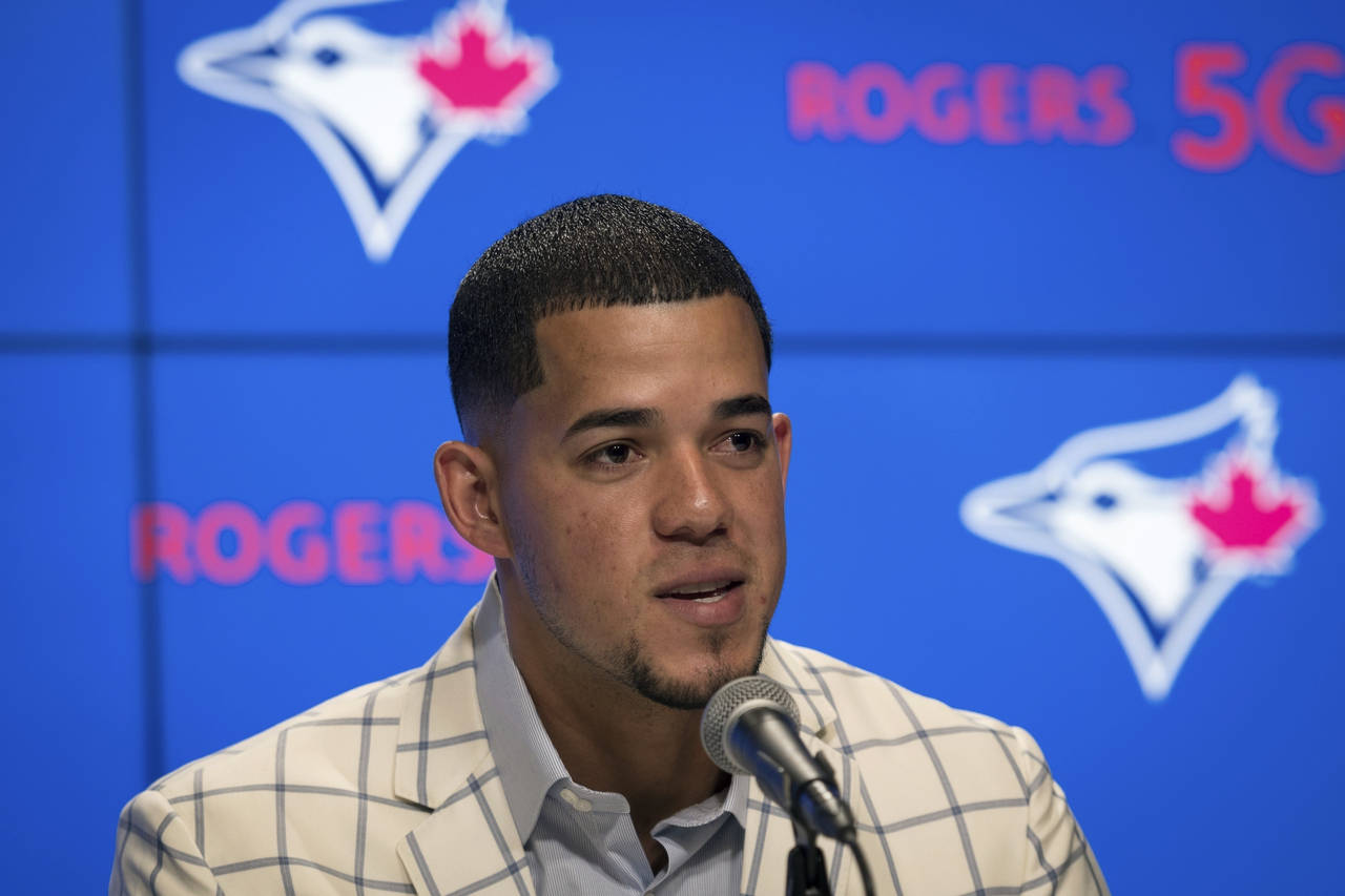 Jose Berrios speaks during a baseball press conference announcing his seven-year extension with the...