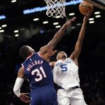 
              New York Knicks guard Immanuel Quickley (5) goes to the basket against Brooklyn Nets forward Paul Millsap (31) during the first half of an NBA basketball game, Tuesday, Nov. 30, 2021, in New York. (AP Photo/Mary Altaffer)
            