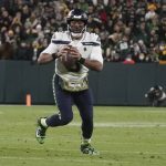 
              Seattle Seahawks' Russell Wilson scrambles during the second half of an NFL football game against the Green Bay Packers Sunday, Nov. 14, 2021, in Green Bay, Wis. (AP Photo/Morry Gash)
            