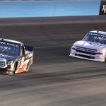 
              Chandler Smith (18) overtakes Kris Wright (2) for the lead early in the NASCAR Truck Series auto race at Phoenix Raceway on Friday, Nov. 5, 2021, in Avondale, Ariz. (AP Photo/Darryl Webb)
            